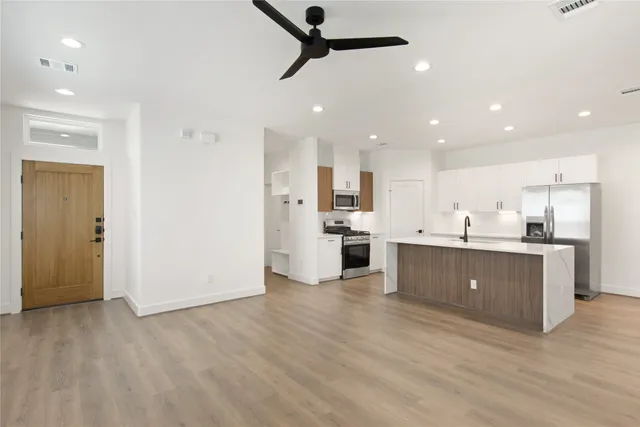 a view of kitchen with wooden floor