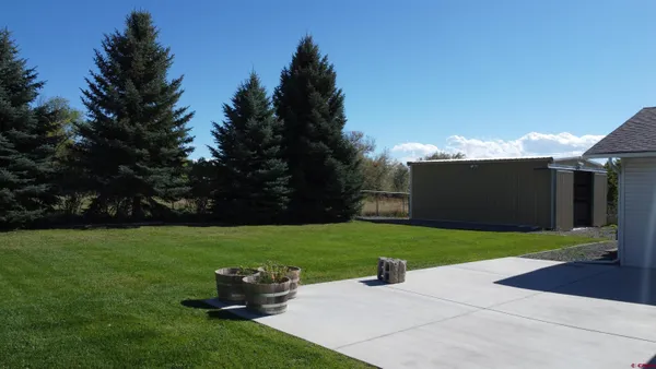 a view of a backyard with garden