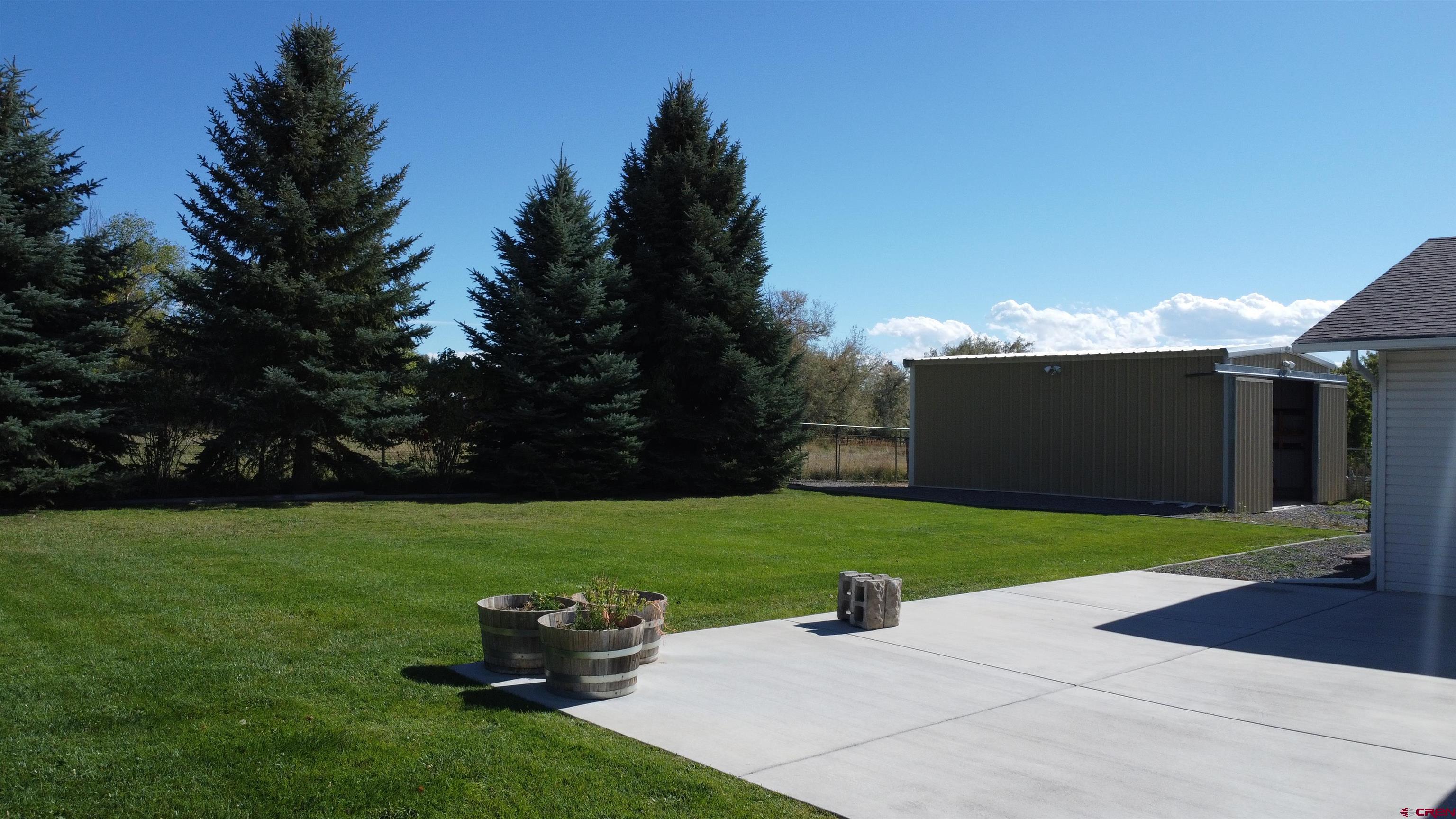 a view of a backyard with garden