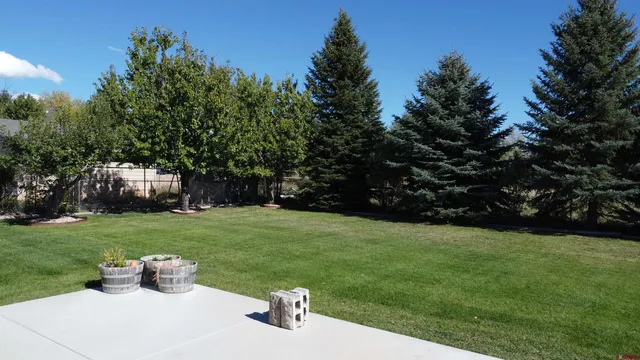 a white house with a yard