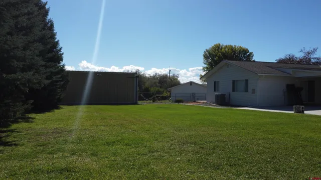 a backyard of a house with lots of green space