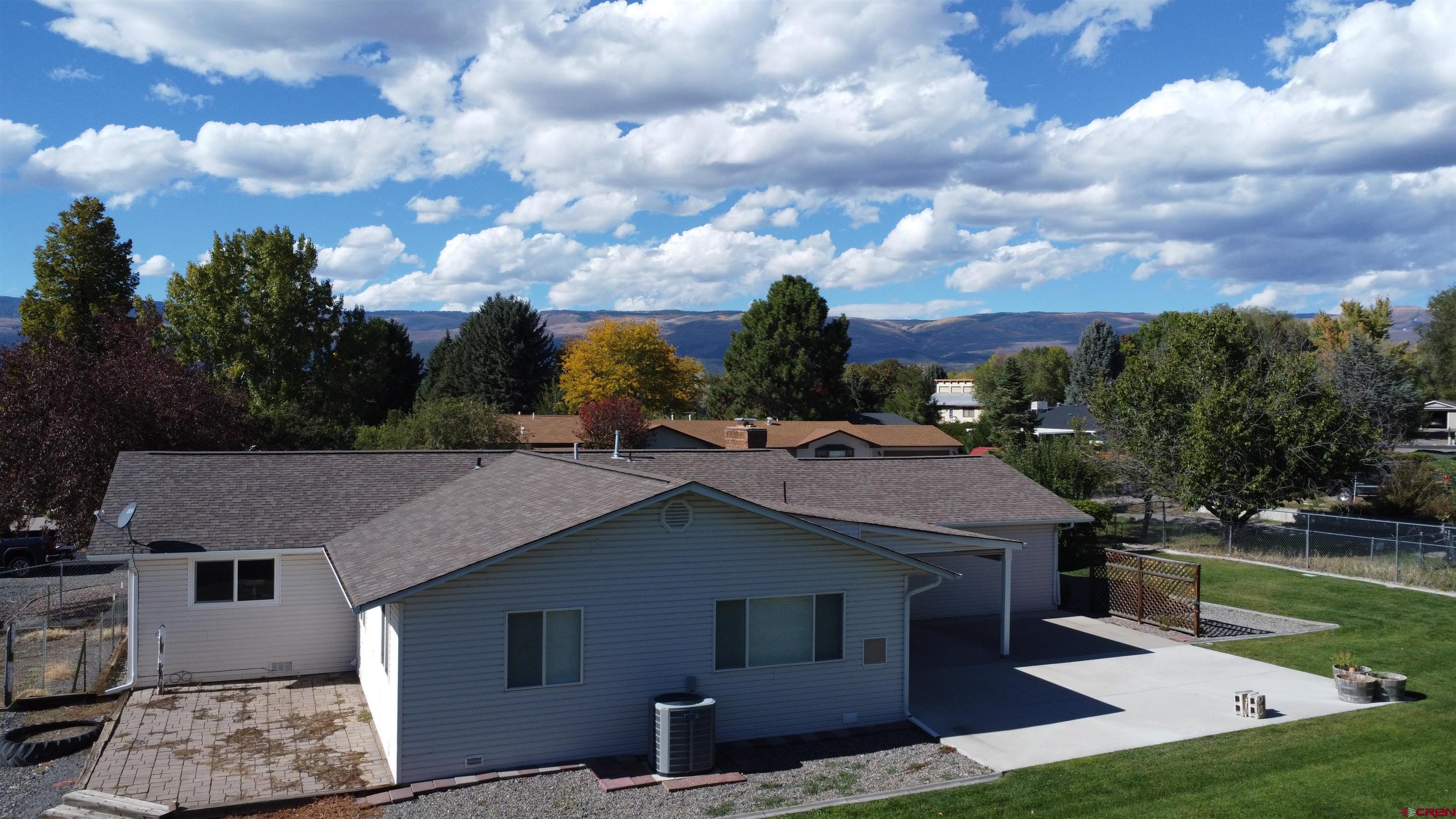 215 Southwest 8th Circle Cedaredge, CO 81413 - Photo 27 of 30 a aerial view of a house next to a yard