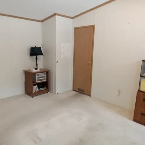 a room with a table and a mirror