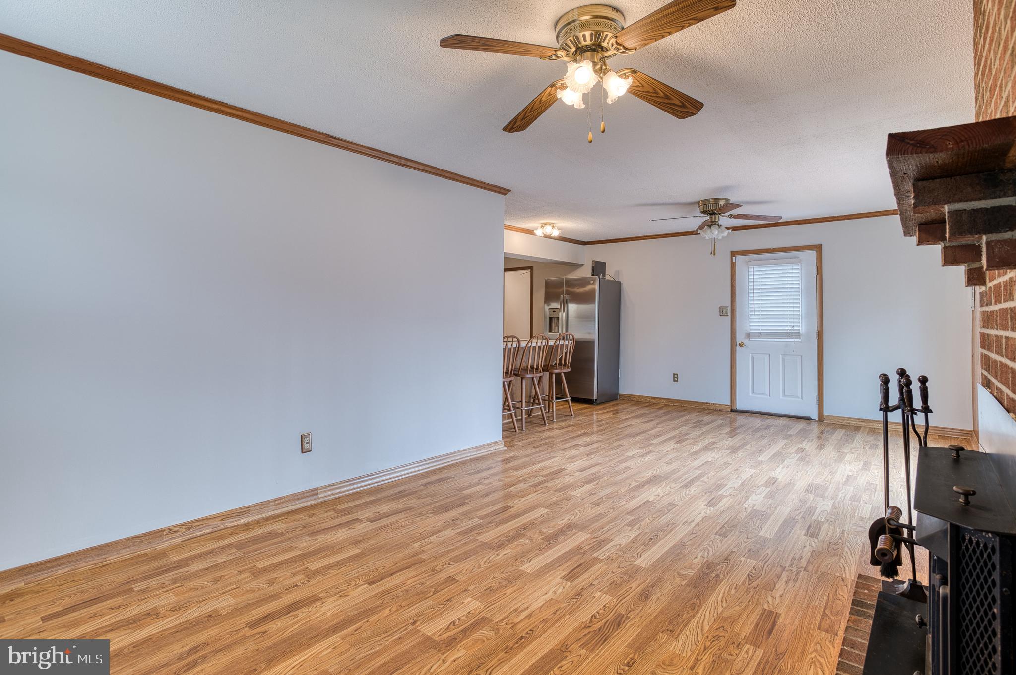 3565 Maple Street Dumfries, VA 22026 - Photo 15 of 36 wooden floor in an empty room