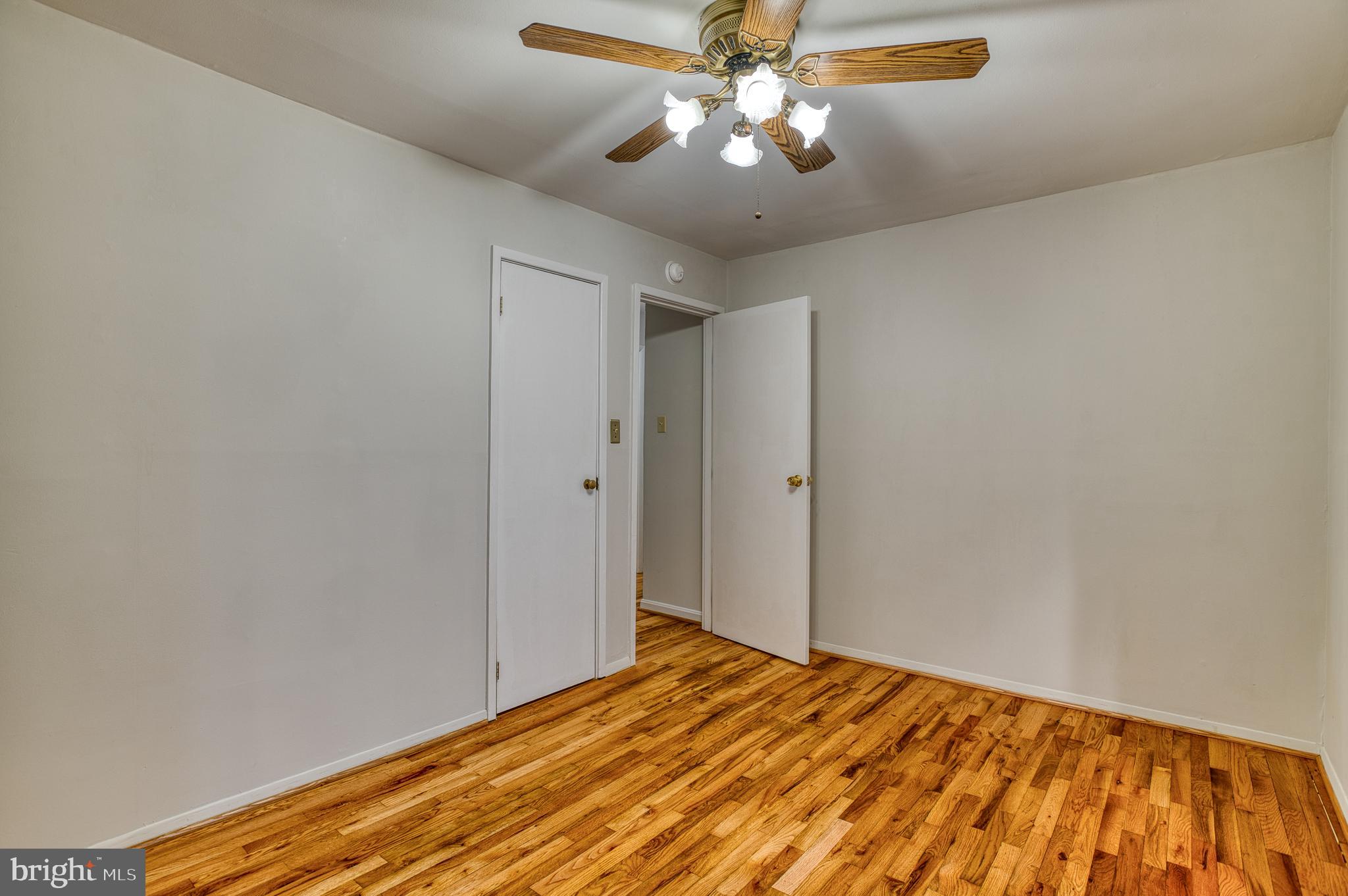 3565 Maple Street Dumfries, VA 22026 - Photo 19 of 36 a view of empty room with wooden floor
