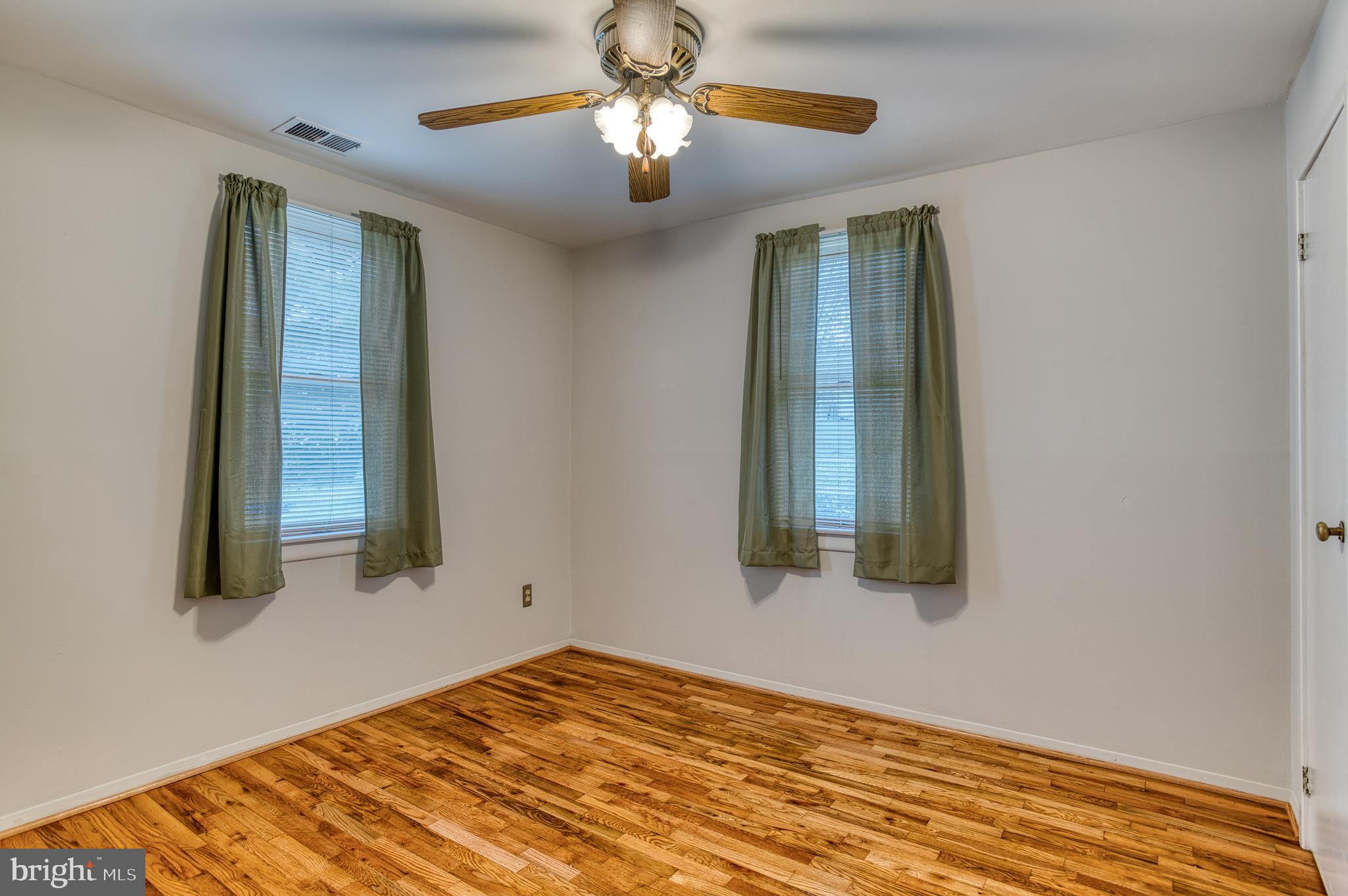3565 Maple Street Dumfries, VA 22026 - Photo 20 of 36 a view of a room that has a bed and a window