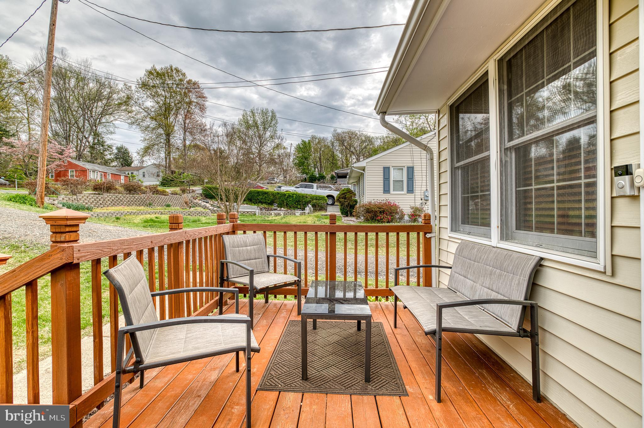 3565 Maple Street Dumfries, VA 22026 - Photo 2 of 36 a view of balcony with wooden floor and outdoor seating