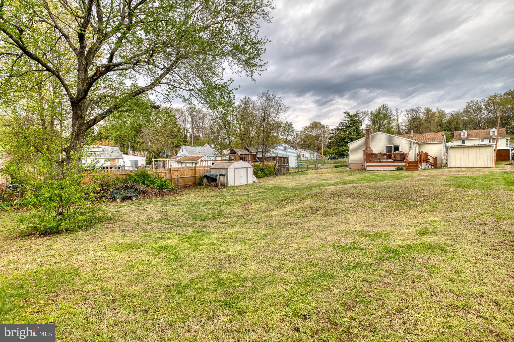 3565 Maple Street Dumfries, VA 22026 - Photo 27 of 36 a view of a yard with swimming pool and furniture