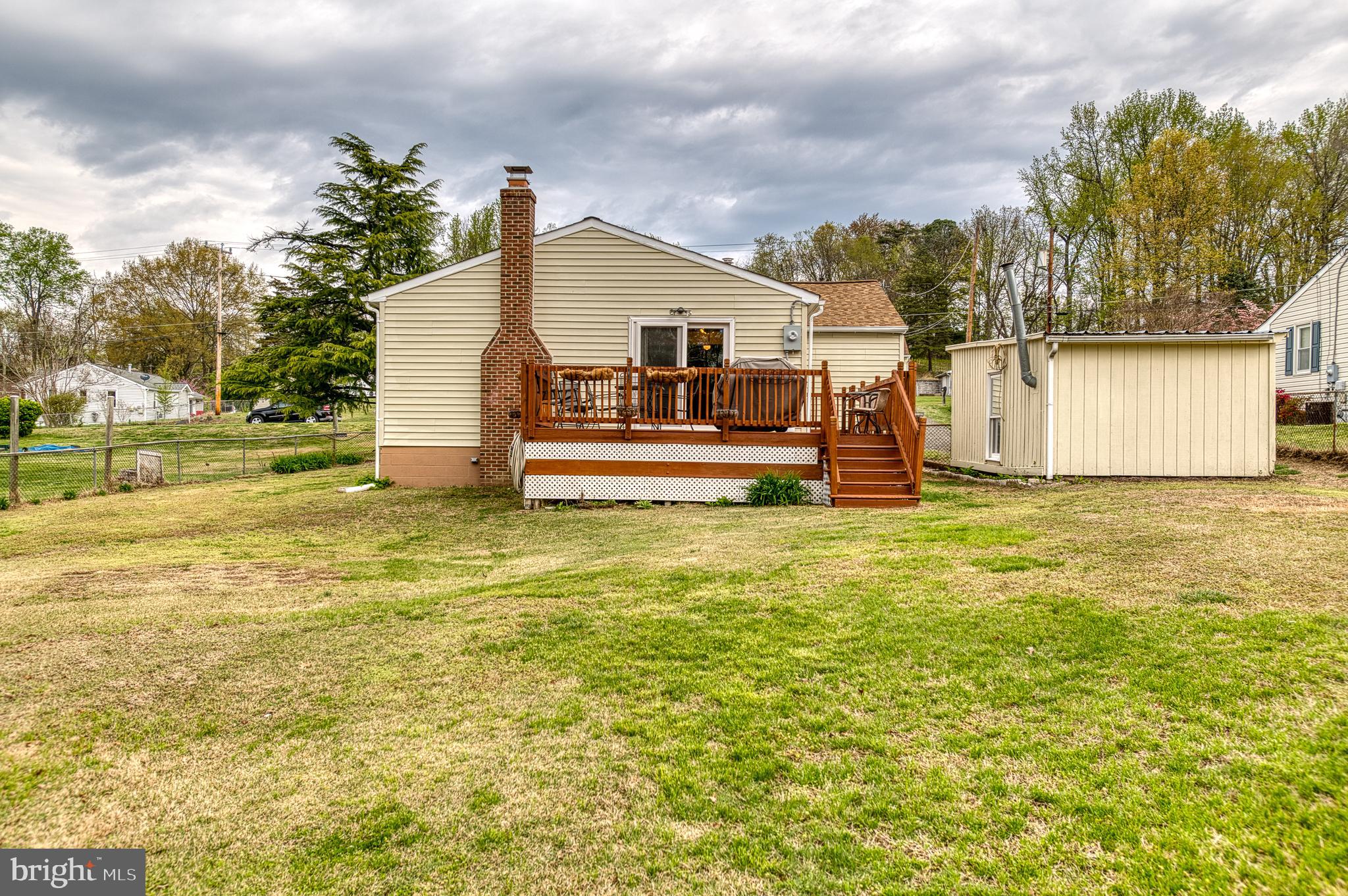 3565 Maple Street Dumfries, VA 22026 - Photo 33 of 36 a front view of a house with a yard