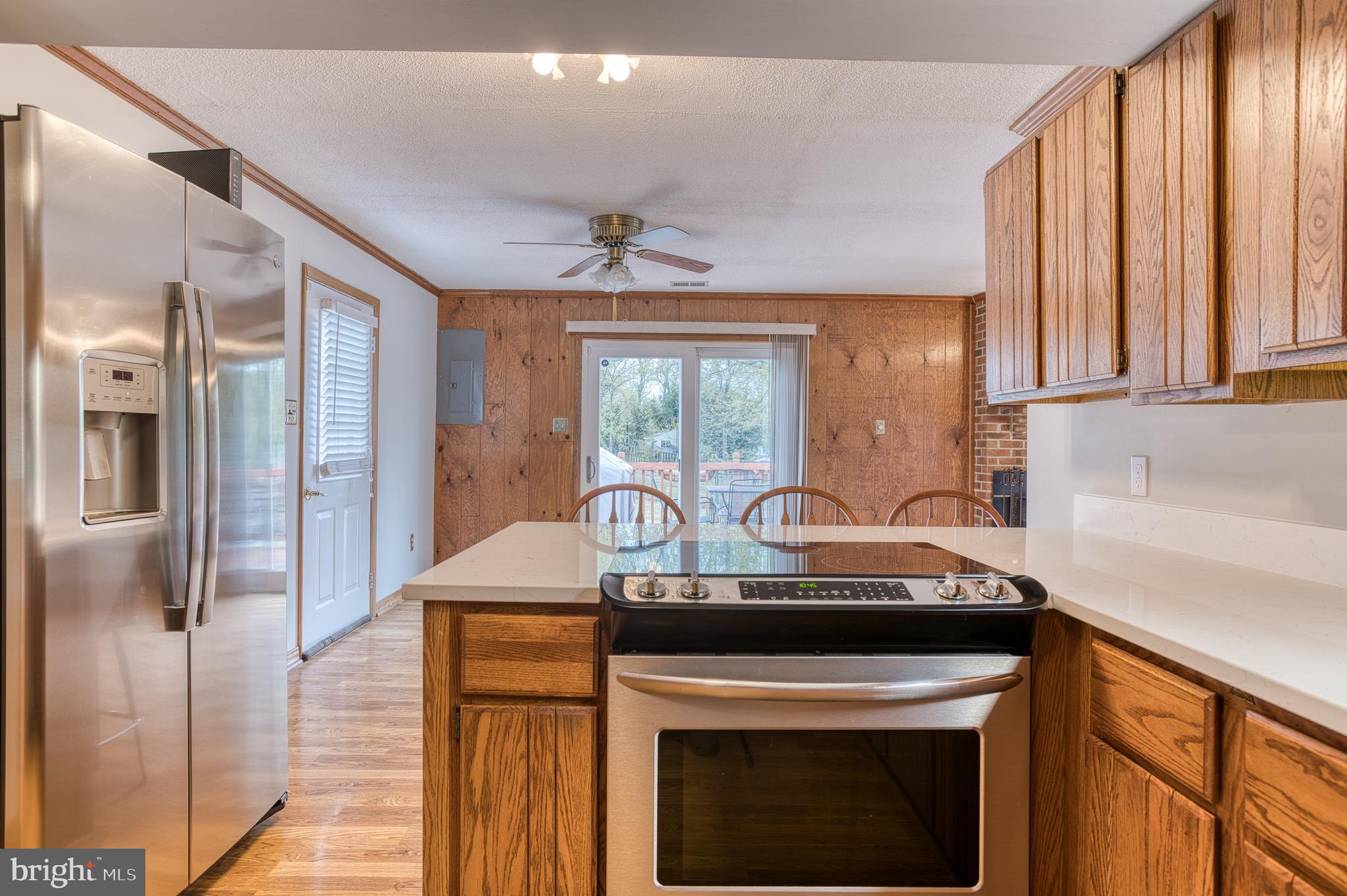 3565 Maple Street Dumfries, VA 22026 - Photo 9 of 36 a kitchen with stainless steel appliances granite countertop a stove a sink and a refrigerator
