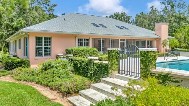 a view of a hallway with a livingroom and a hallway