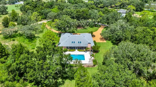a spacious bathroom with a double vanity sink a mirror and a bathtub