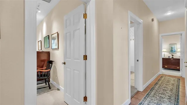 a living room with furniture and large windows