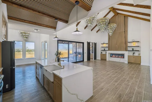 a kitchen with a refrigerator and a sink