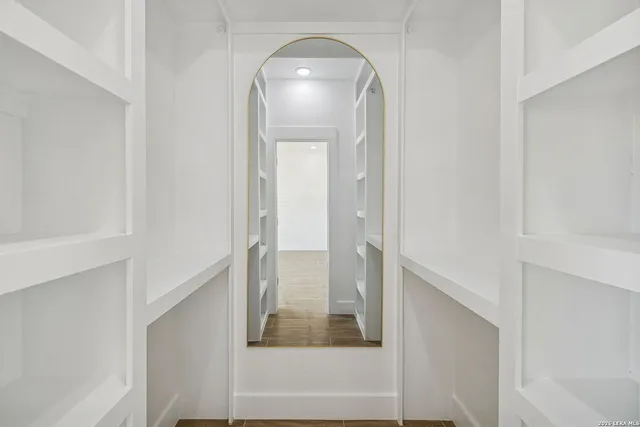 a spacious bathroom with a sink a toilet and shower