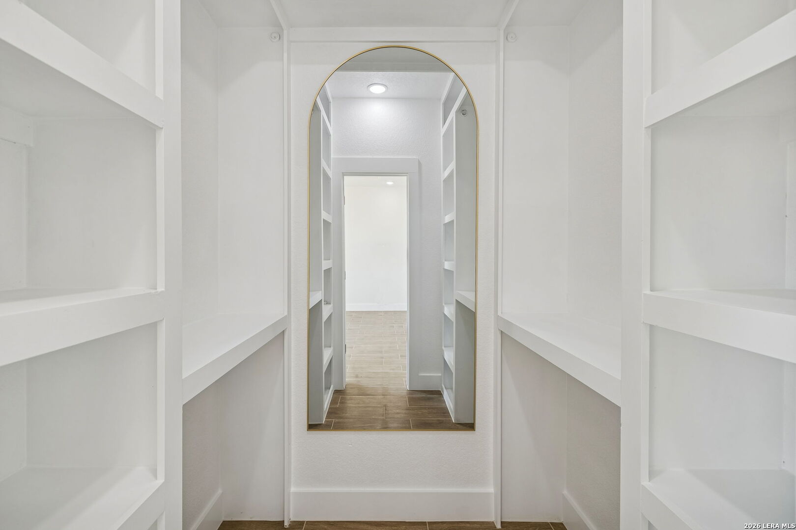 187 Hidden Ranch Court Floresville, TX 78114 - Photo 18 of 37 a view of a hallway with wooden floor and staircase