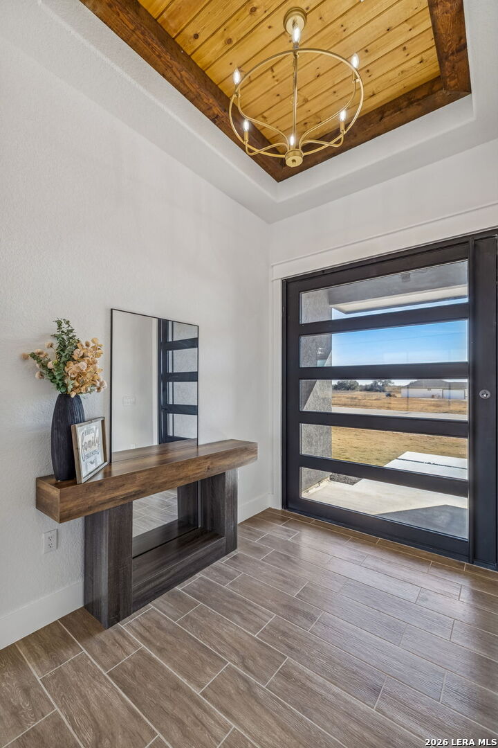 187 Hidden Ranch Court Floresville, TX 78114 - Photo 2 of 37 a view of room with wooden floor