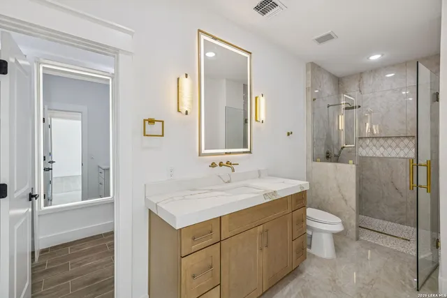 a view of an entryway with wooden floor