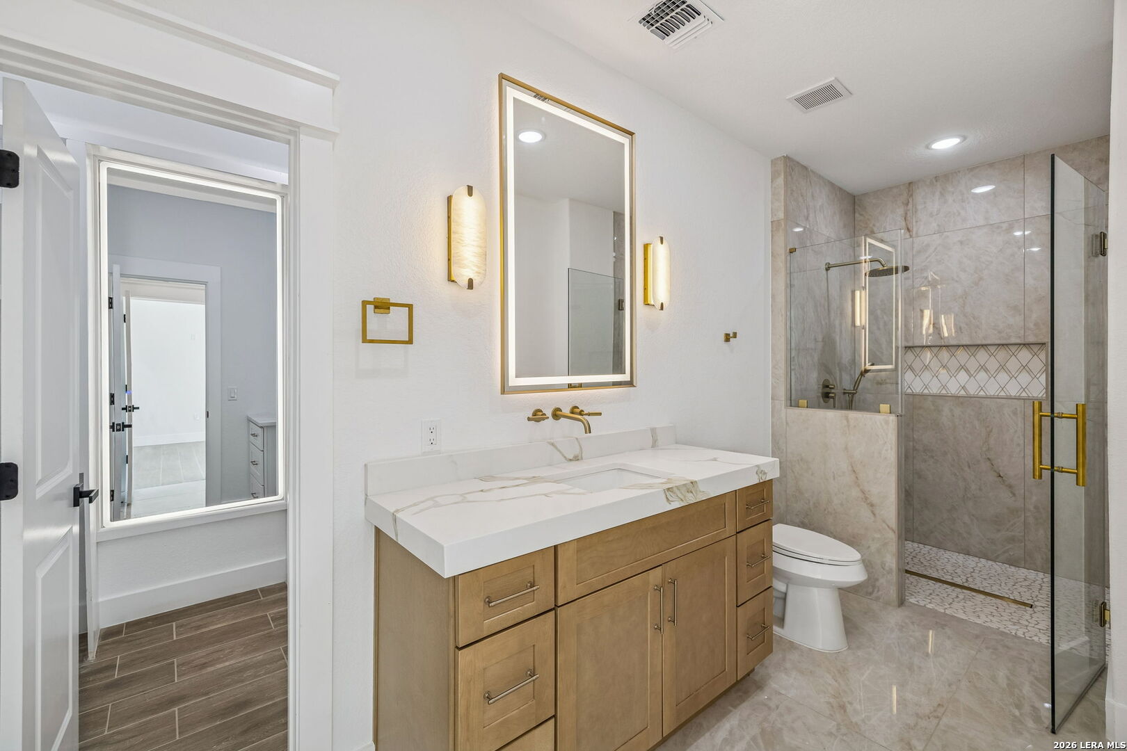 187 Hidden Ranch Court Floresville, TX 78114 - Photo 26 of 37 a bathroom with a sink a toilet and shower