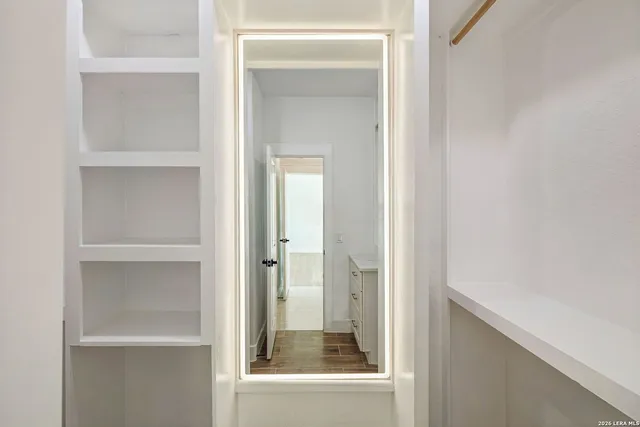 a view of an empty room with a window