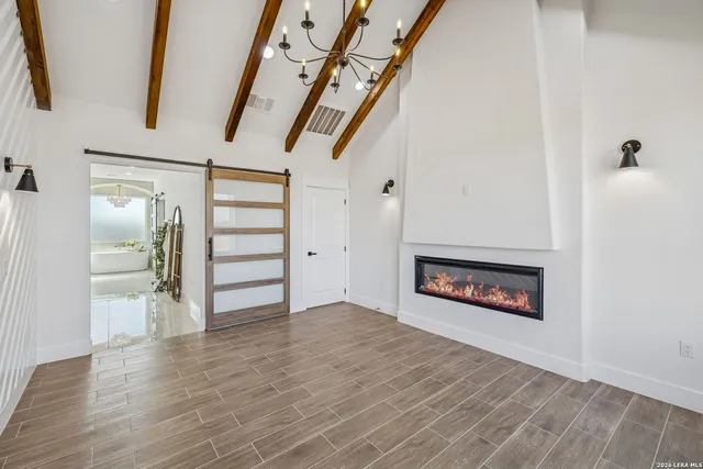 a bathroom with a double vanity sink mirror and shower