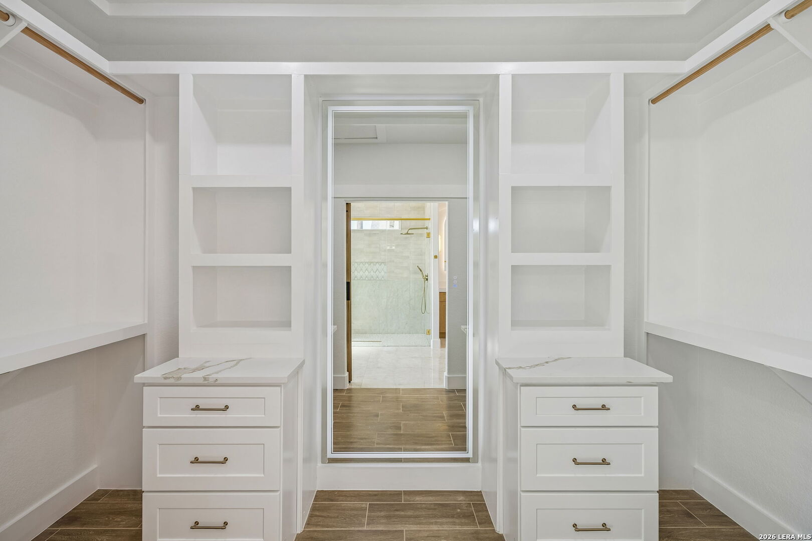 187 Hidden Ranch Court Floresville, TX 78114 - Photo 34 of 37 a view of walk in closet with cabinet