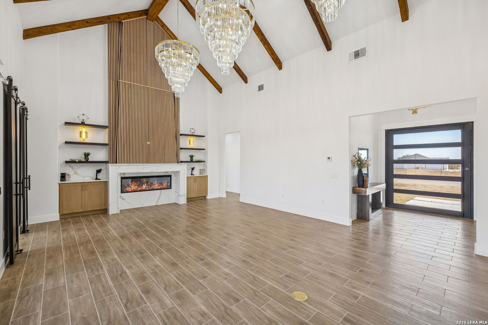 187 Hidden Ranch Court Floresville, TX 78114 - Photo 5 of 37 a view of a kitchen with furniture and wooden floor