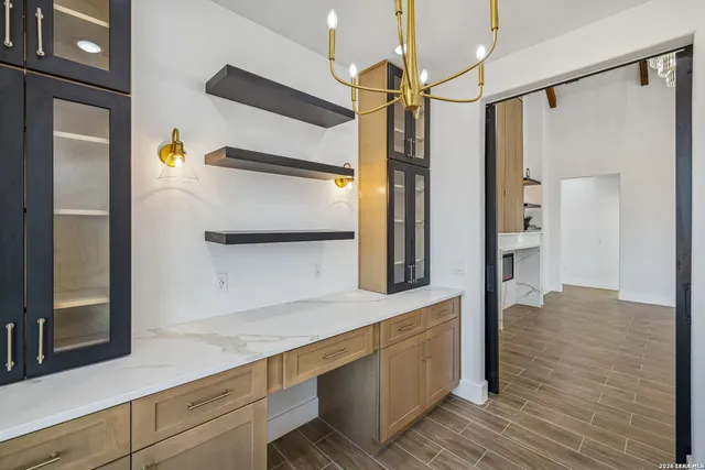 a kitchen with stainless steel appliances a refrigerator and a sink