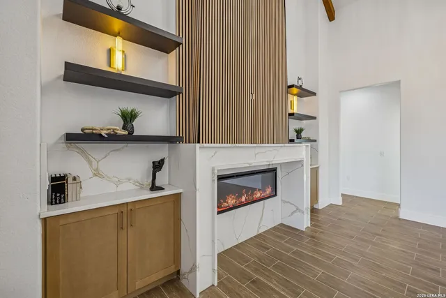 a living room with furniture and a fireplace