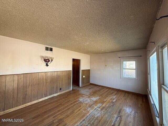 1809 K Street Sparks, NV 89431 - Photo 14 of 18 wooden floor in an empty room with a window
