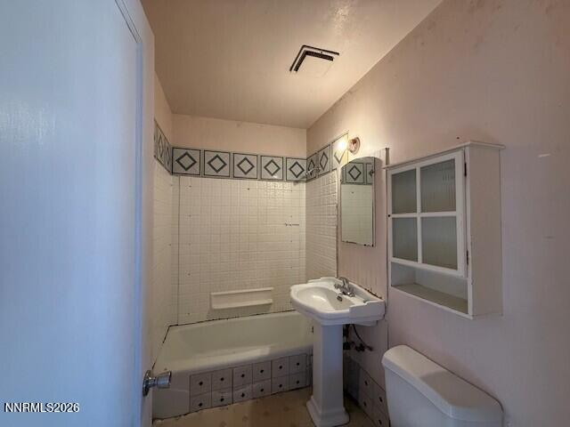 1809 K Street Sparks, NV 89431 - Photo 10 of 18 a bathroom with a sink toilet and shower