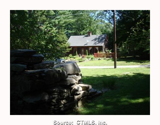 159 Packer Road Groton, CT 06355 - Photo 1 of 1 a backyard of a house with table and chairs