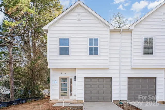 a view of a house with a garage
