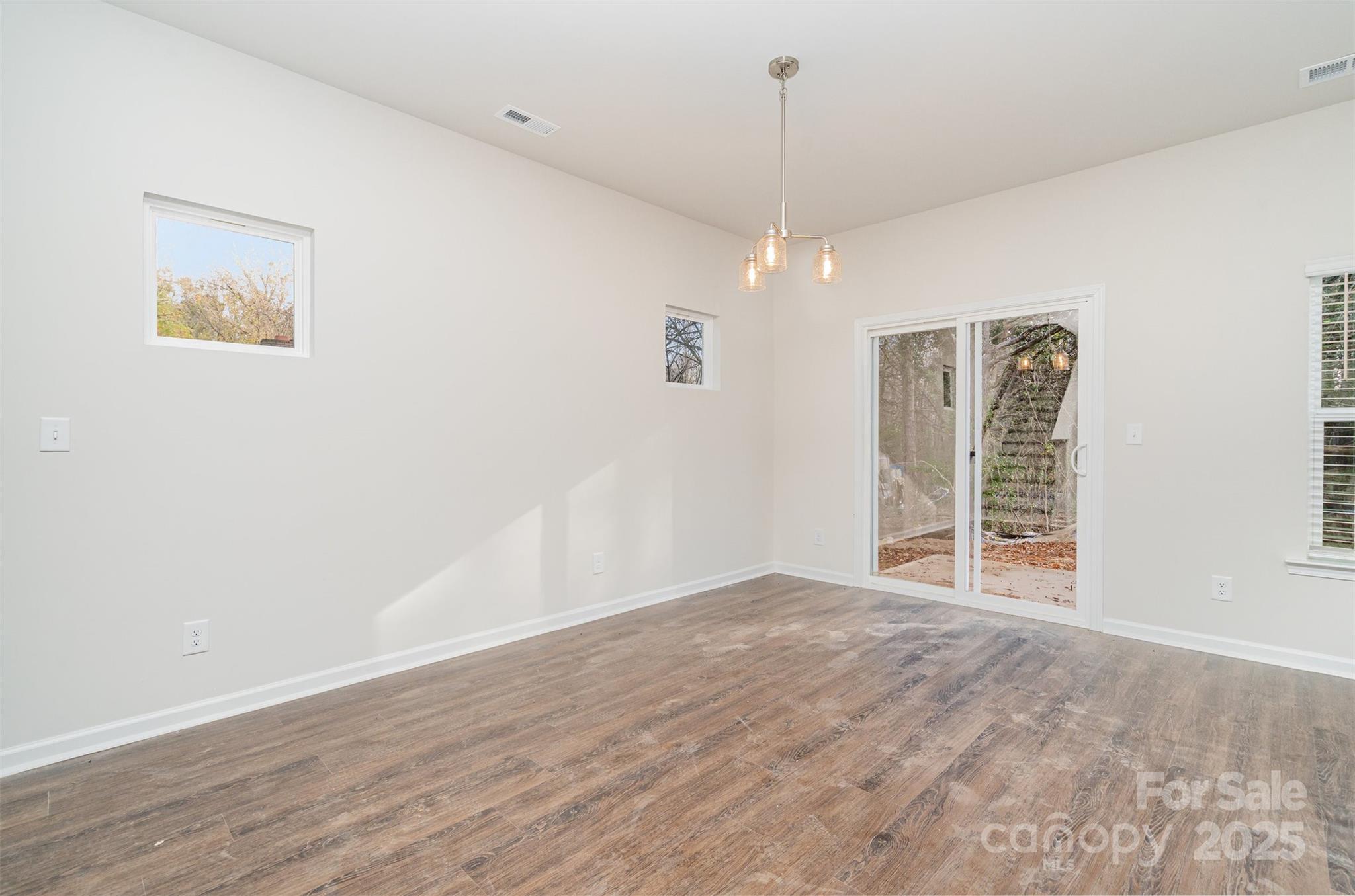 7312 Boswell Road Charlotte, NC 28215 - Photo 16 of 33 a view of an empty room with a window