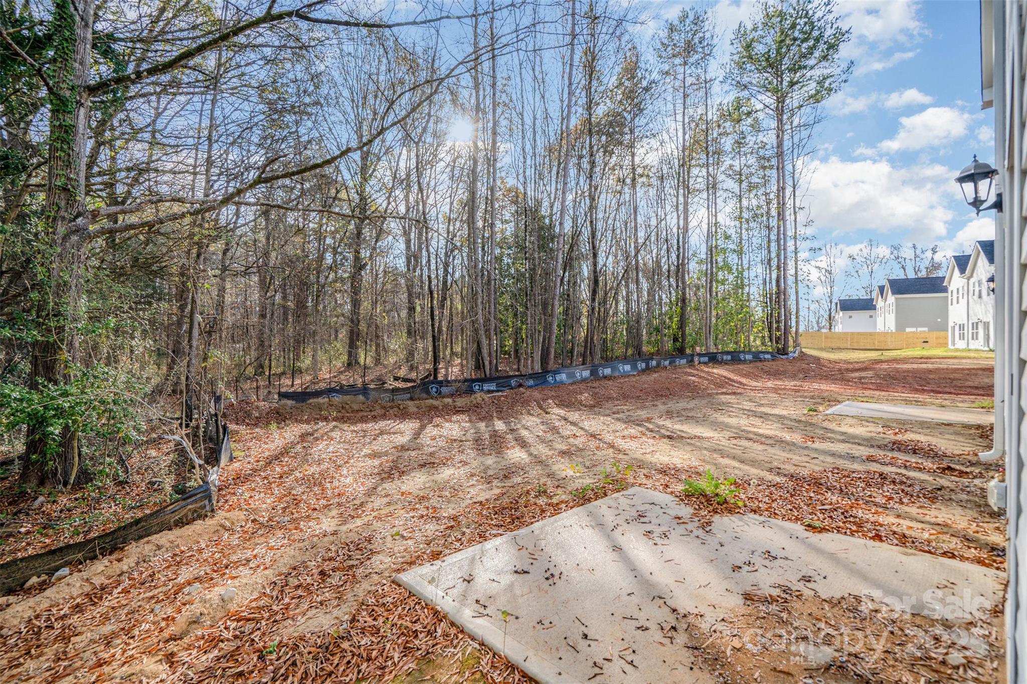 7312 Boswell Road Charlotte, NC 28215 - Photo 33 of 33 a view of backyard with large trees and wooden fence
