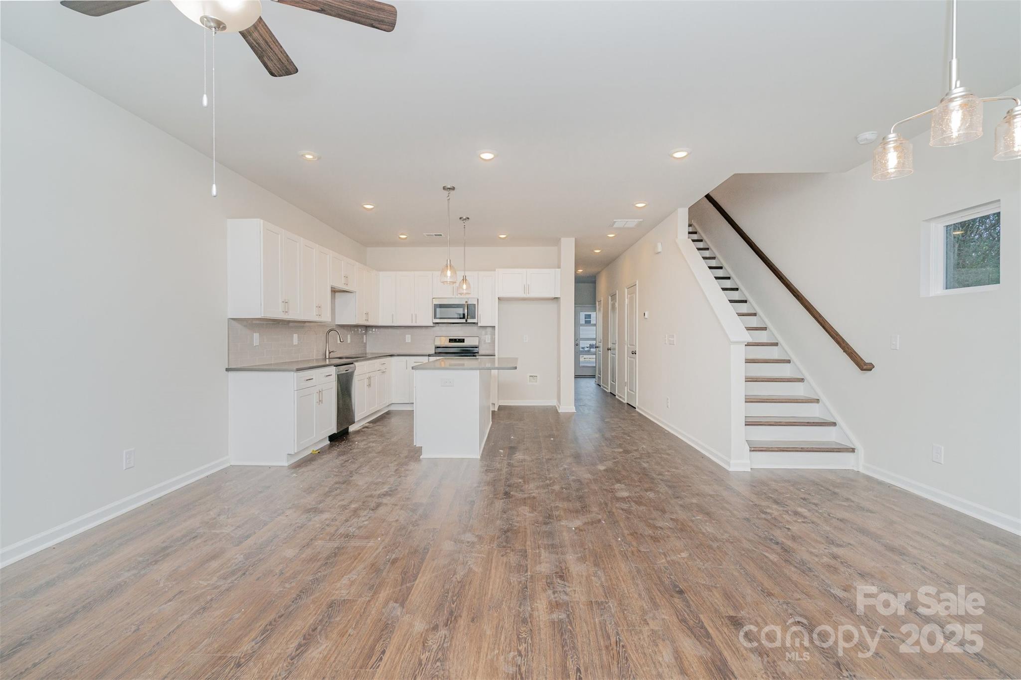 7312 Boswell Road Charlotte, NC 28215 - Photo 8 of 33 a view of kitchen with wooden floor