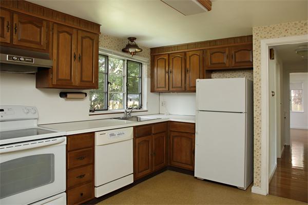 91 Albert Road Newton, MA 02466 - Photo 3 of 7 a kitchen with appliances a sink and lots of cabinets