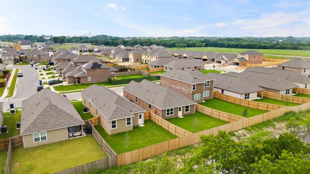 1609 Romans Road Ennis, TX 75119 - Photo 17 of 17 an aerial view of residential houses with outdoor space and river