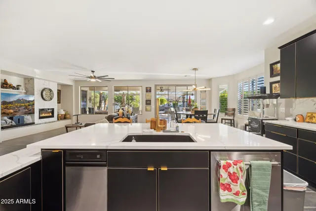 a kitchen with stainless steel appliances a stove and cabinets