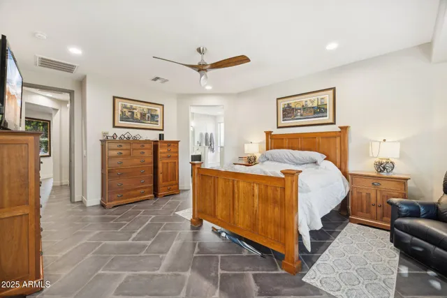 a bed room with a bed and a couch