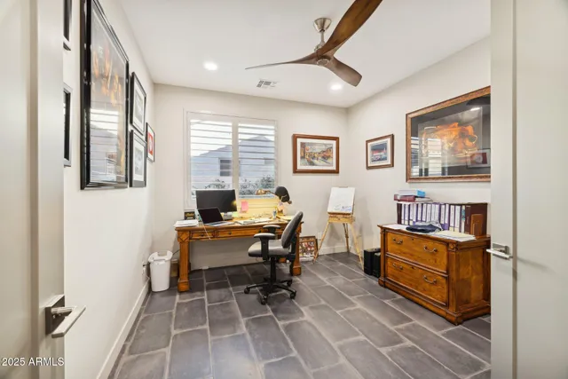 a bathroom with a sink vanity and toilet