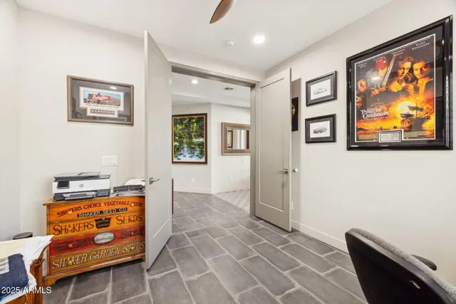 a work room with furniture and a window