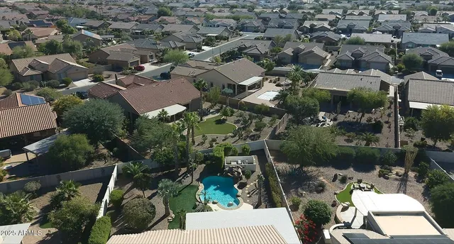 an aerial view of a backyard and outdoor kitchen