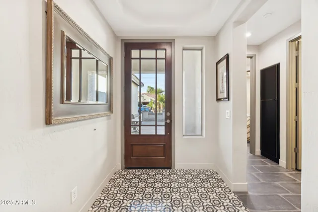 a house with potted plants in front of it