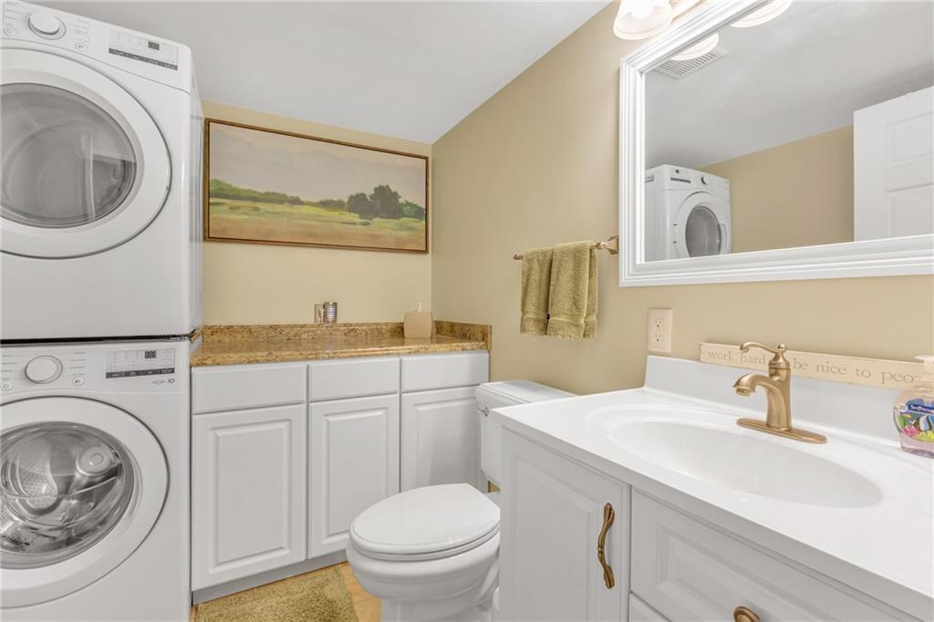 106 Truman Street Monaca, PA 15061 - Photo 15 of 25 a bathroom with a sink a mirror and a toilet