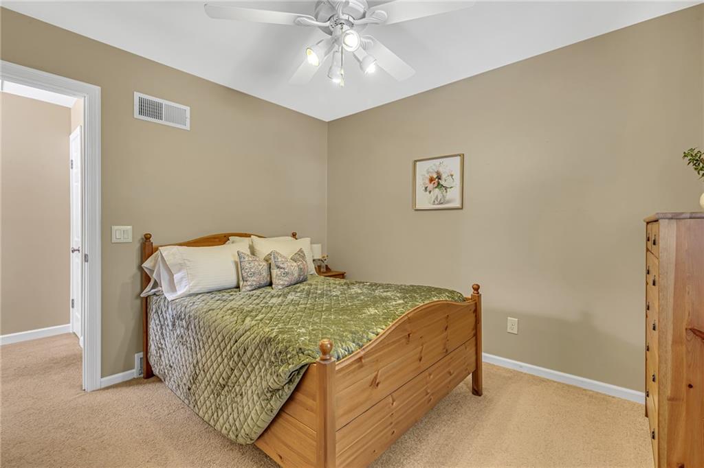 106 Truman Street Monaca, PA 15061 - Photo 19 of 25 a bedroom with a bed and a ceiling fan