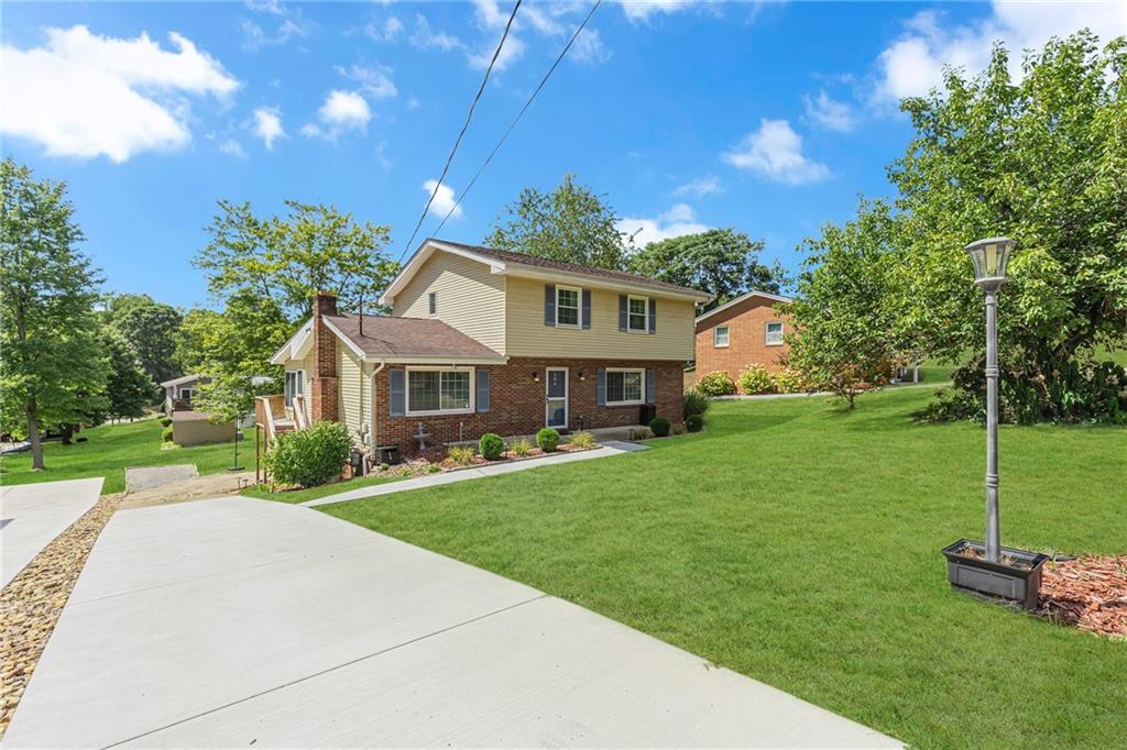 106 Truman Street Monaca, PA 15061 - Photo 2 of 25 a front view of a house with a yard
