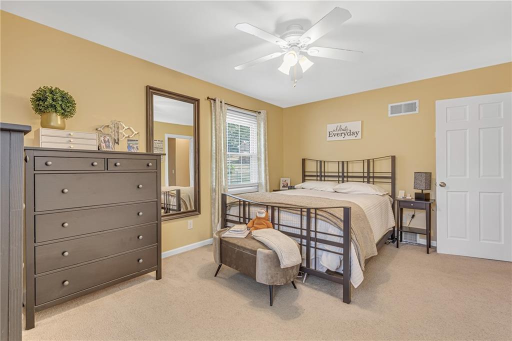 106 Truman Street Monaca, PA 15061 - Photo 23 of 25 a bedroom with a large bed and a chandelier