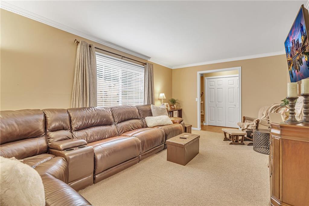 106 Truman Street Monaca, PA 15061 - Photo 4 of 25 a living room with furniture and a large window