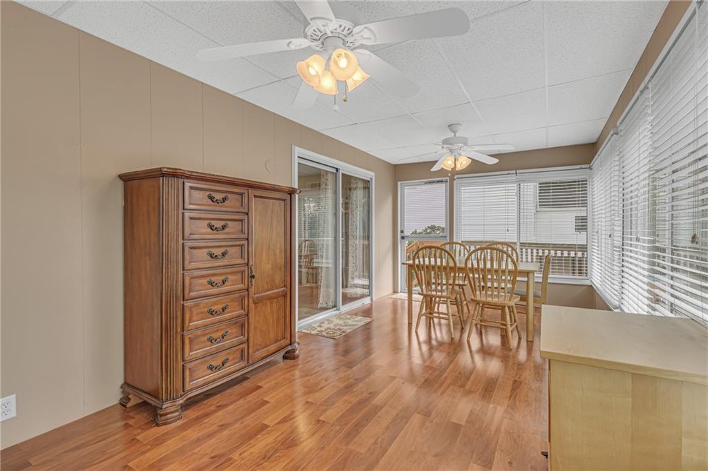 106 Truman Street Monaca, PA 15061 - Photo 9 of 25 a dining room with furniture a chandelier and wooden floor